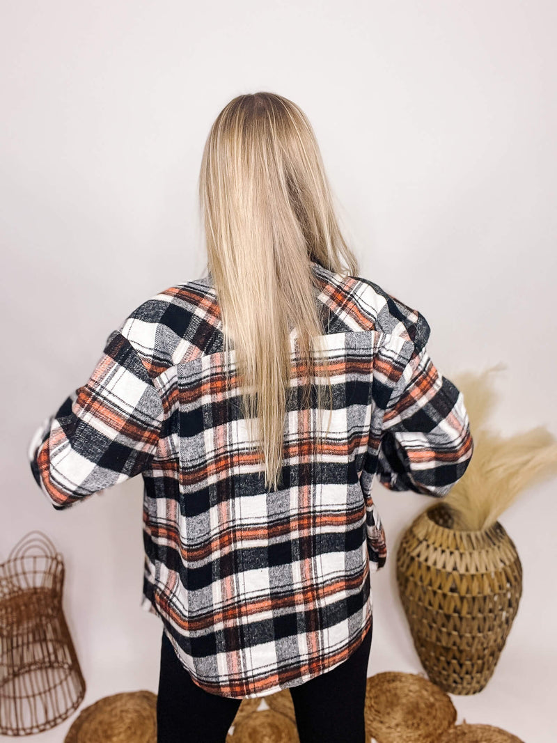 Active Basic Black and Orange Plaid Jacket with Two Side Pockets, Two Chest Pockets, a button up front and an oversized fit with a medium weight material.Active Basic Black and Orange Plaid Jacket with Two Side Pockets, Two Chest Pockets, a button up front and an oversized fit with a medium weight material.