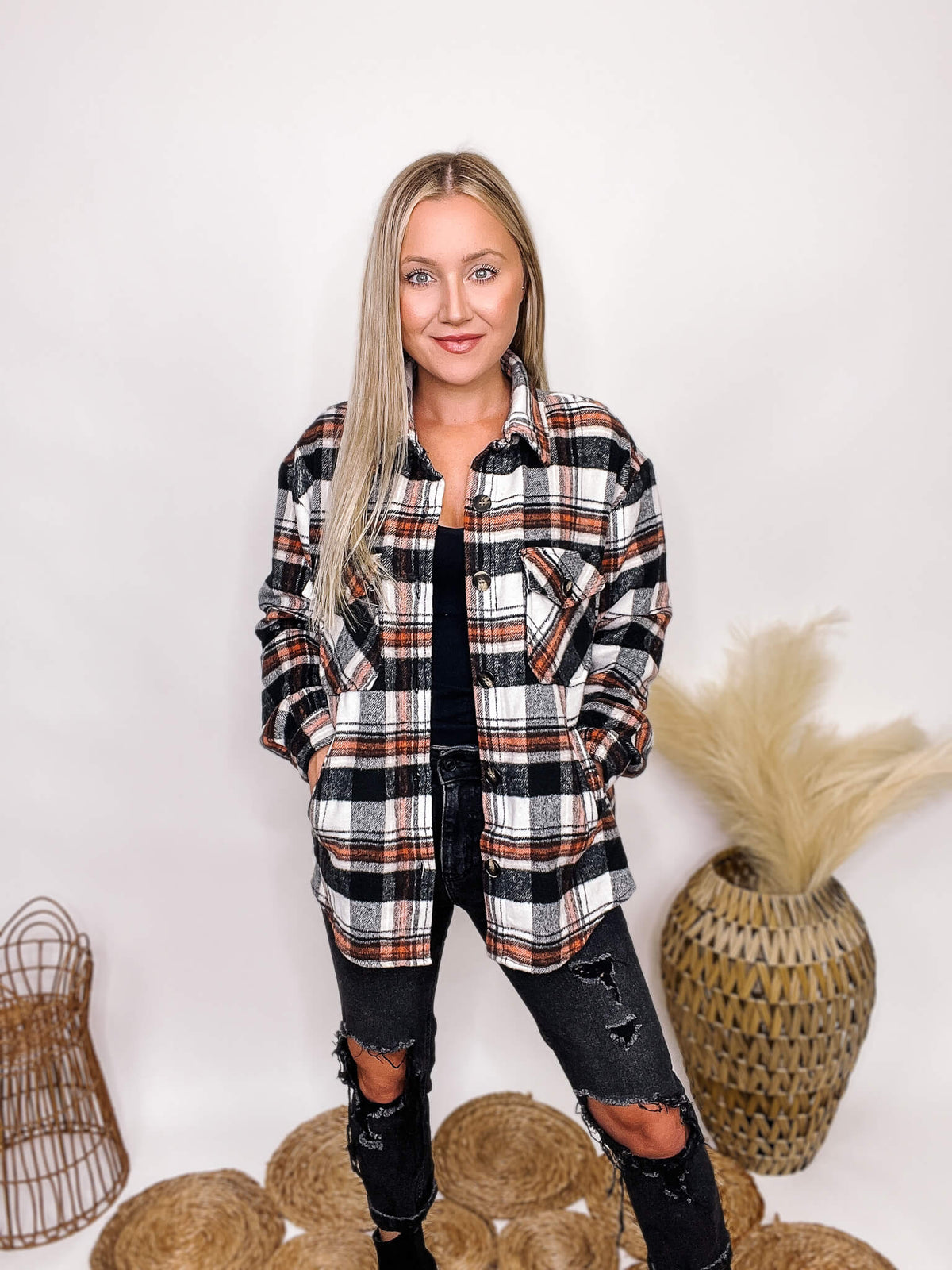 Active Basic Black and Orange Plaid Jacket with Two Side Pockets, Two Chest Pockets, a button up front and an oversized fit with a medium weight material.