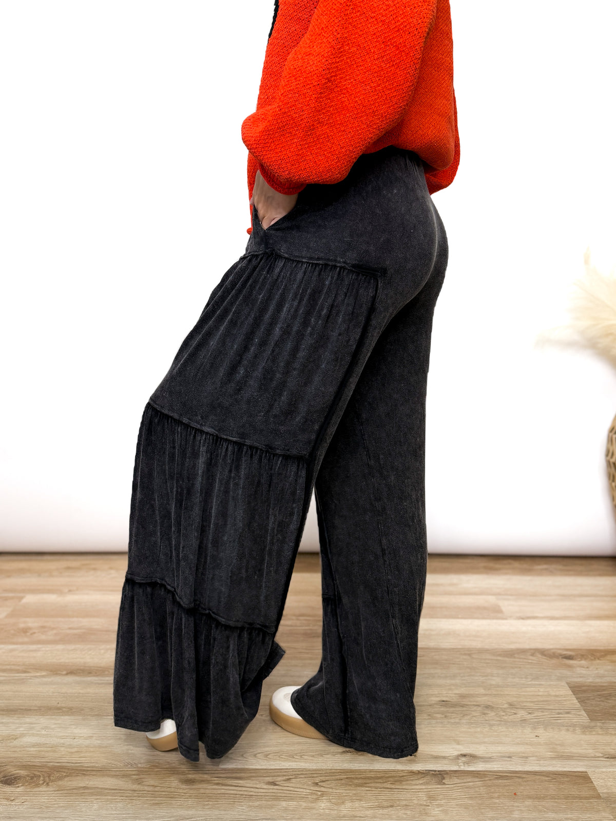 Black acid washed tiered flared wide leg boho pants with elastic drawstring waist and side pockets. Soft cotton, perfect for dressing up or down.