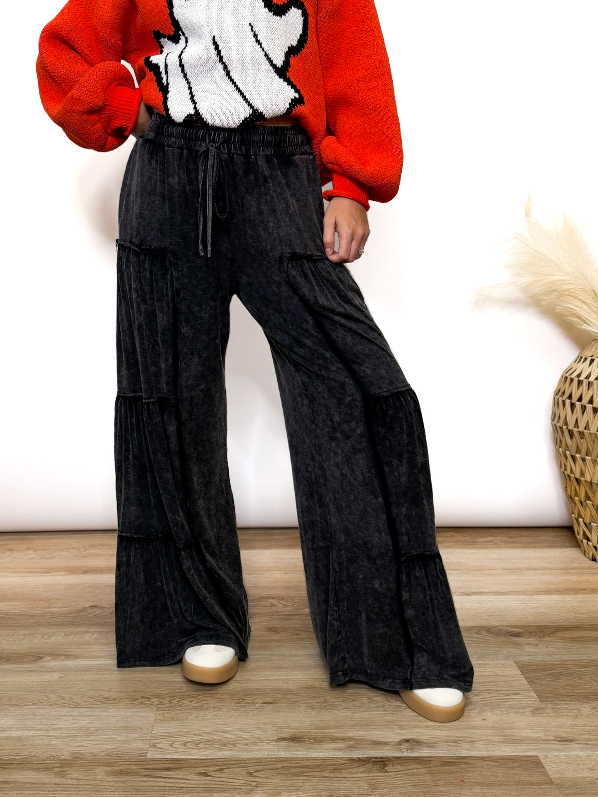 Black acid washed tiered flared wide leg boho pants with elastic drawstring waist and side pockets. Soft cotton, perfect for dressing up or down.