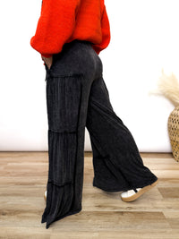 Black acid washed tiered flared wide leg boho pants with elastic drawstring waist and side pockets. Soft cotton, perfect for dressing up or down.