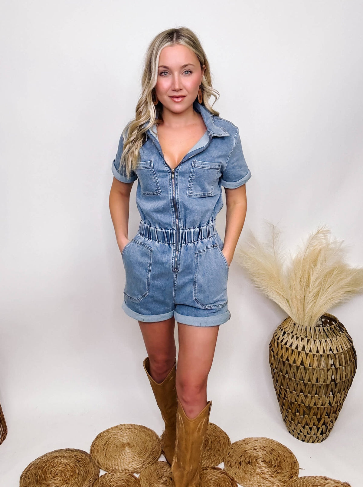 Blue B Blue Stretchy Denim Utility Romper with Zip-Up Front, Stretchy Elastic Cinched Waist, Double Side Pockets, Back Pockets, Chest Pockets. Fitted with Stretch, True to Size. Made of 97% Cotton, 3% Spandex.