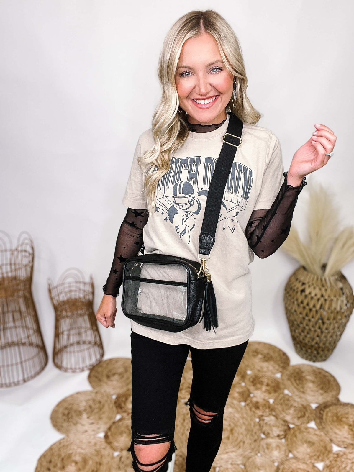 Clear with Black and Gold Accents Cross PU Cross Body Bag Leather Walls and Trim Detachable Black Leather Tassel Full Zipper Closure One Outer Open Pocket Detachable Canvas Strap Approximately 6.5" T x 10" L x 2.5" W Strap Drop 15" - 24" L