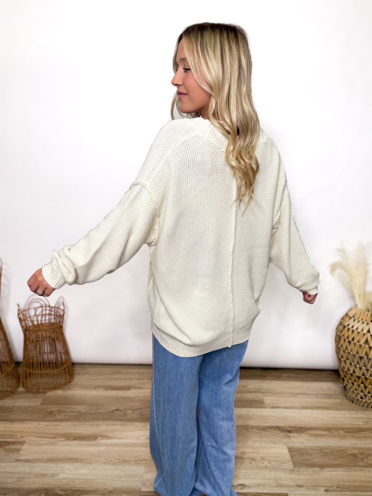 cream oversized button up cardigan with v neck and front pockets styled for fall layering