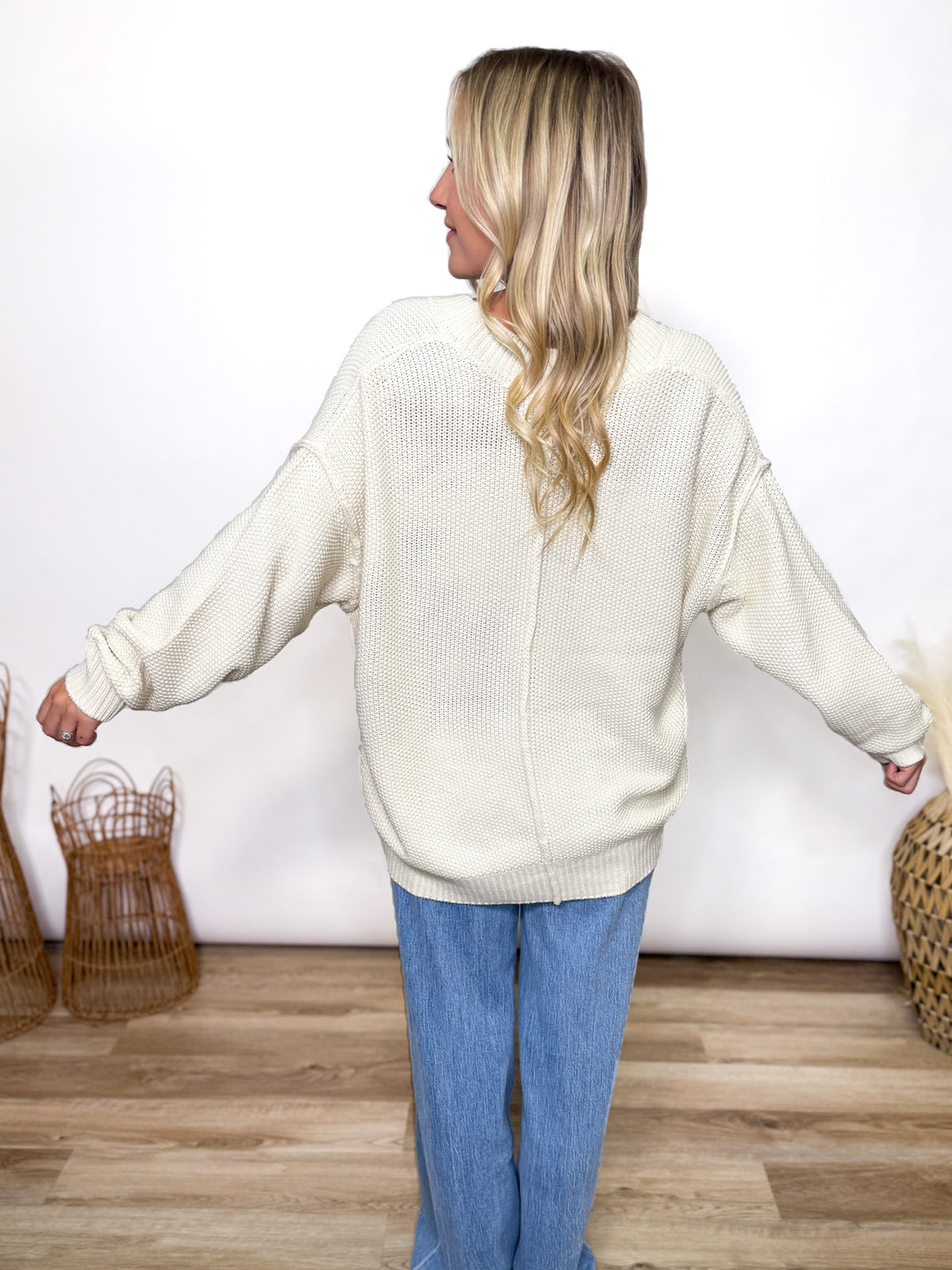 cream oversized button up cardigan with v neck and front pockets styled for fall layering