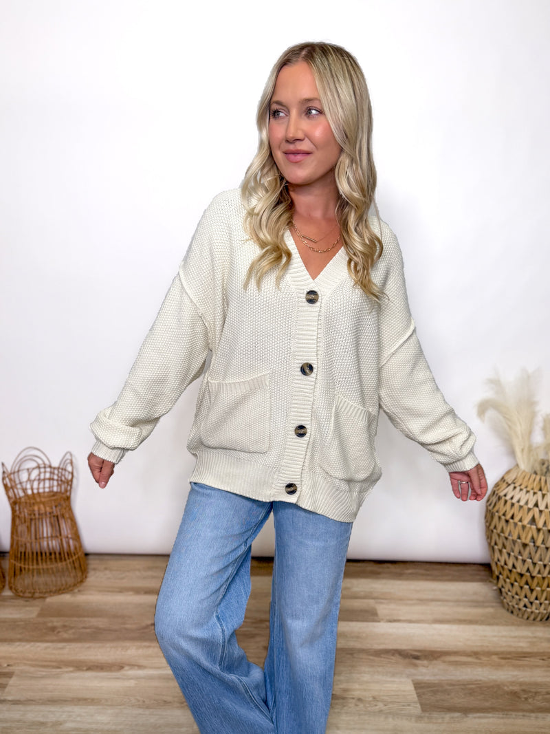 cream oversized button up cardigan with v neck and front pockets styled for fall layering