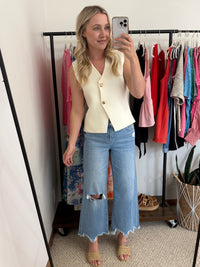 Cream asymmetrical sweater vest with gold buttons