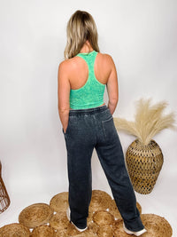 Ash Black Wide Leg Pants Elastic Drawstring Waistband Exposed Seam Details Side Pockes Back Pocket Tie Details at Ankle for Jogger Fit Fleece Lined Relaxed Fit 51% Cotton, 49% Polyester Brooke is 5'4 wearing size small.