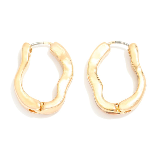 Small wavy gold hoop earrings with hinged clasp