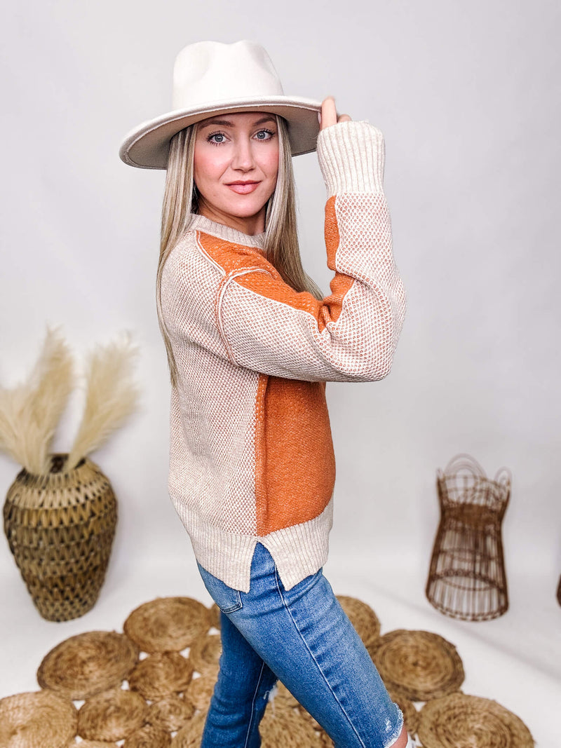 La Miel Orange and Cream Soft Textured Sweater Raw Seam Details Side Slits Soft and Stretchy Relaxed Roomy Fit 42% Acrylic, 30% Polyester, 28% Cotton