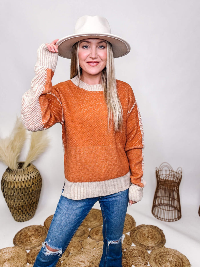 La Miel Orange and Cream Soft Textured Sweater Raw Seam Details Side Slits Soft and Stretchy Relaxed Roomy Fit 42% Acrylic, 30% Polyester, 28% Cotton