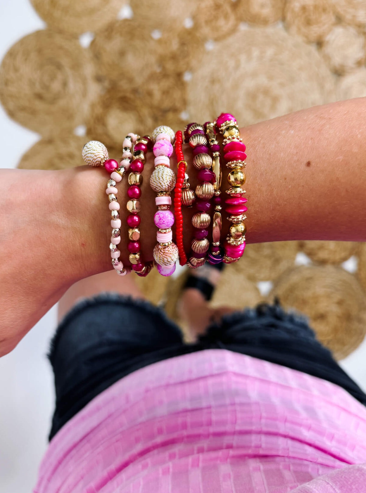 Pink Set of Seven Beaded Stretch Bracelets Featuring Gold Tones And Metallic Rope Wrapped Beads