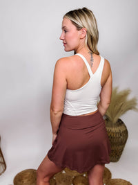Rae Mode White Pearl Tank Top with One Thin Strap Padded Buttery Soft Material Fitted and Stretchy 84% Poly Microfiber, 16% Spandex Brooke is 5'4 wearing size small.