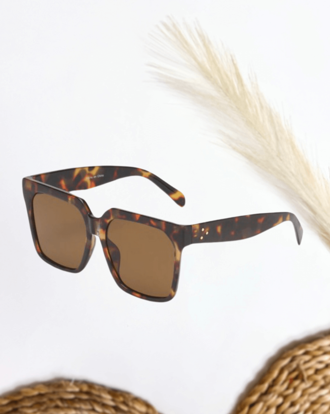 Oversized Square Flat Top Sunglasses in Desert Tortoise Frame Material: Plastic Lens Material: PC 100% UVA and UVB Protection One Size