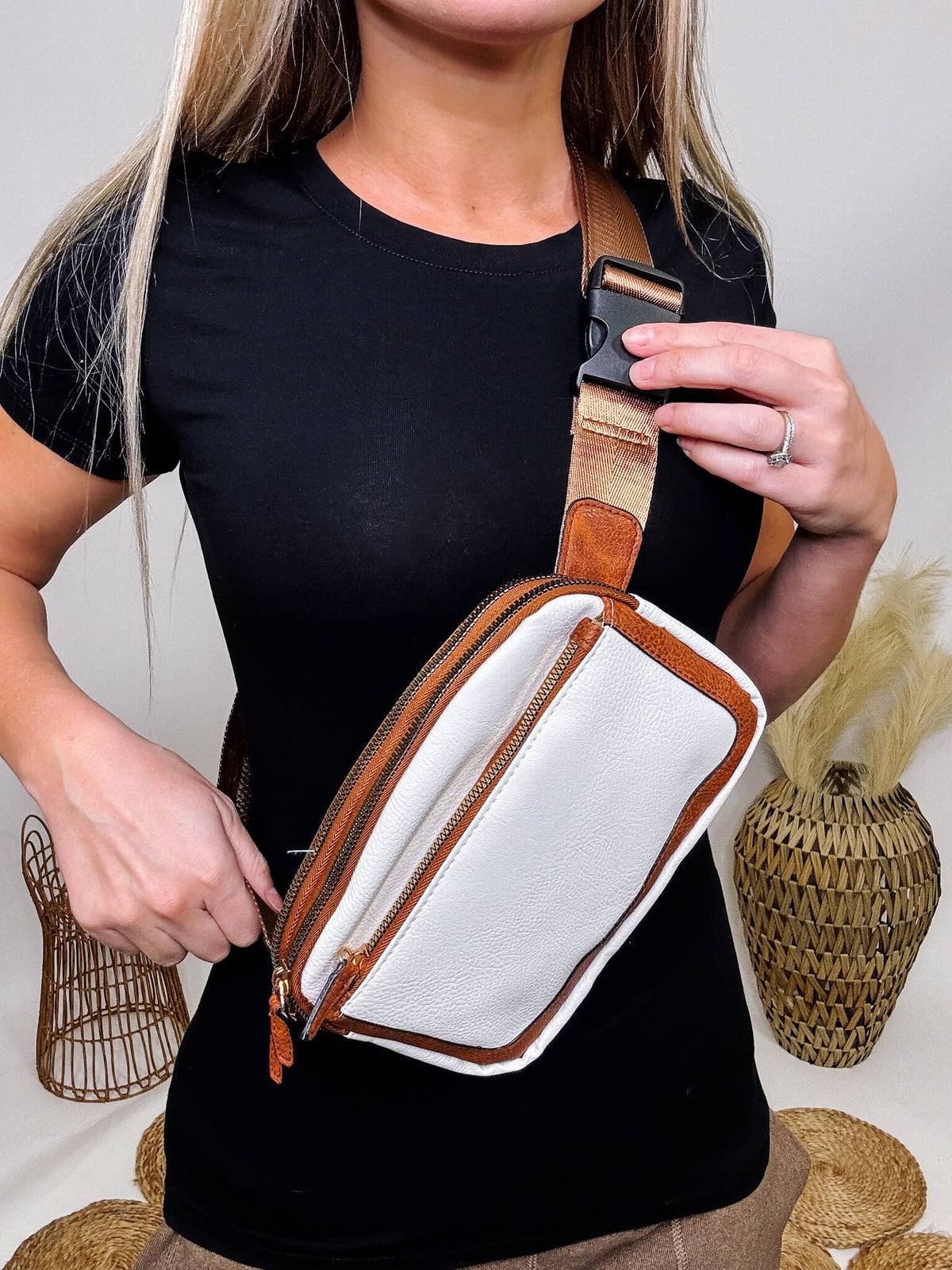 White and Brown Faux Leather Mineral Washed Sling Cross Body Bag Front Pocket  Adjustable Buckle Strap Full Double Zip Closure Lined With Internal Mesh Pockets Approximately 8"W x 5.75"H x 2.25"D Material: PU