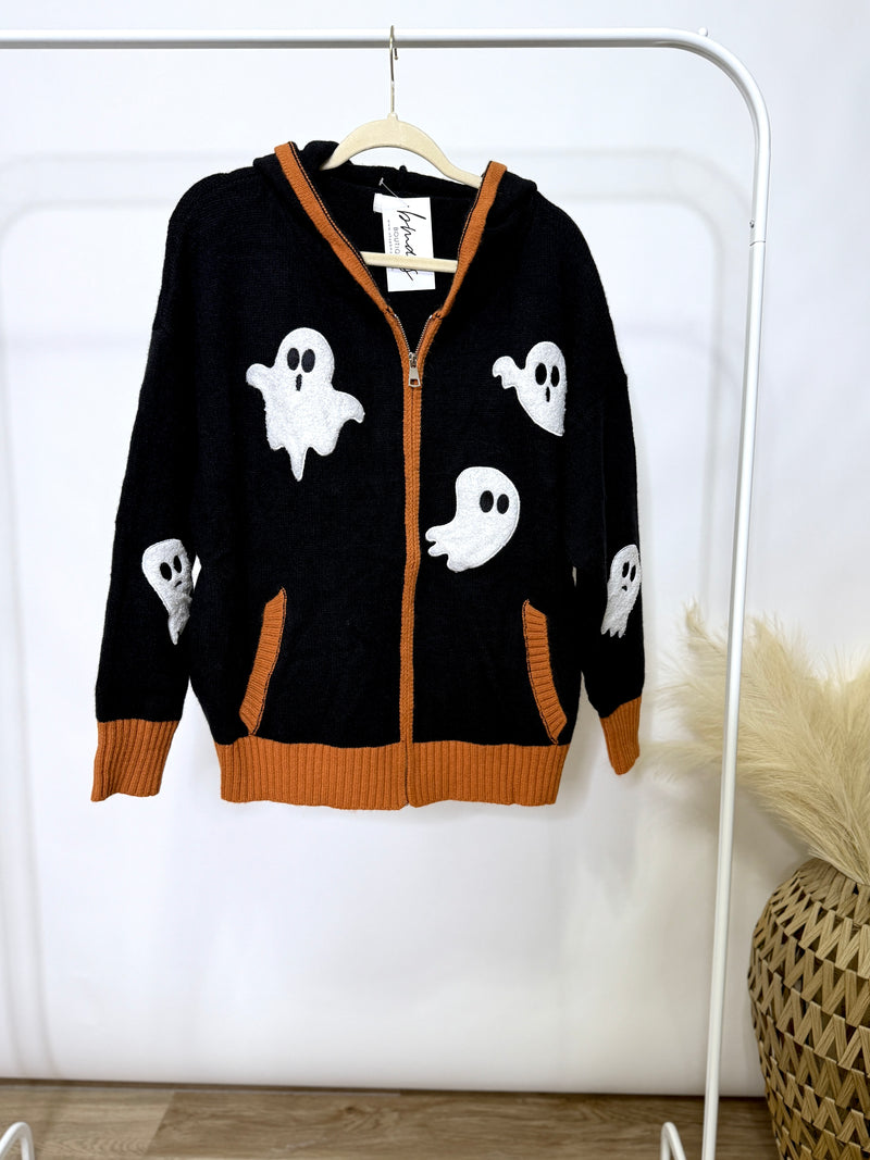 Halloween ghost zip up hoodie jacket - hanging on clothing rack - orange trim black jacket 