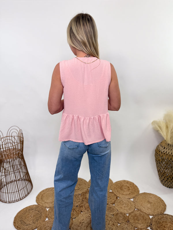 Blush pink self-tie bow tank vest with ruffle hem, featuring a feminine sleeveless design, adjustable bow front, and lightweight flowy fit.