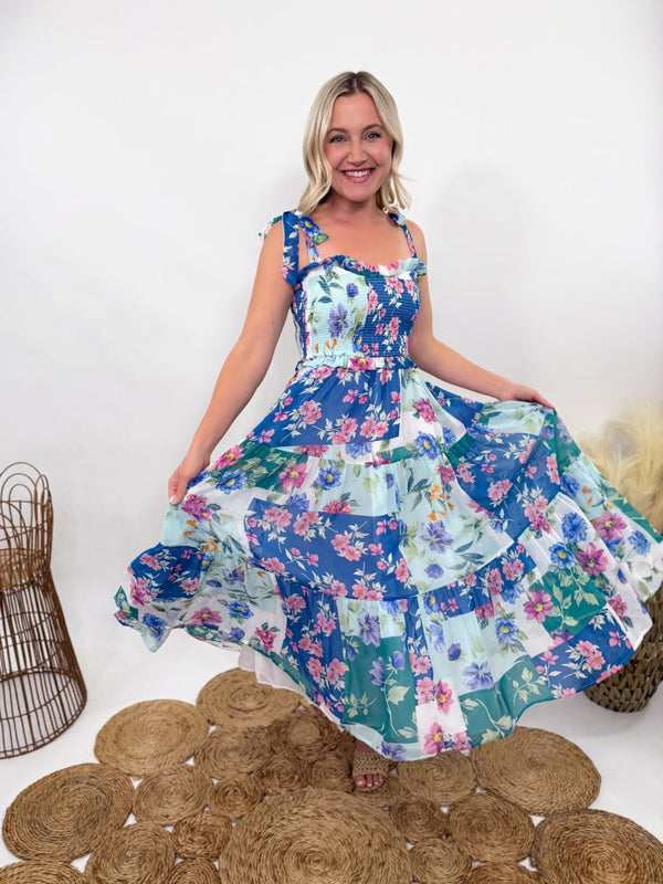 Blue Skies Vintage Floral Smocked Tiered Maxi Dress with Pocket – Ruffle sweetheart neckline, smocked stretchy fitted top, tiered flowy body, adjustable self-tying straps, side pockets, and fully lined. Perfect for spring and summer occasions like Easter, weddings, and baby showers. Bump-friendly and flattering for all body types.