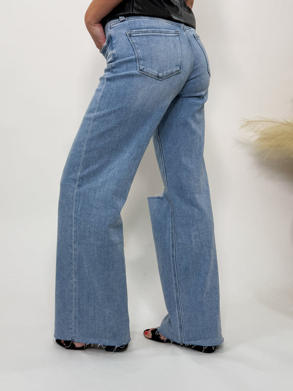 Flying Monkey wide leg comfort stretch distressed jeans with raw hem, customizable length, and casual chic style.