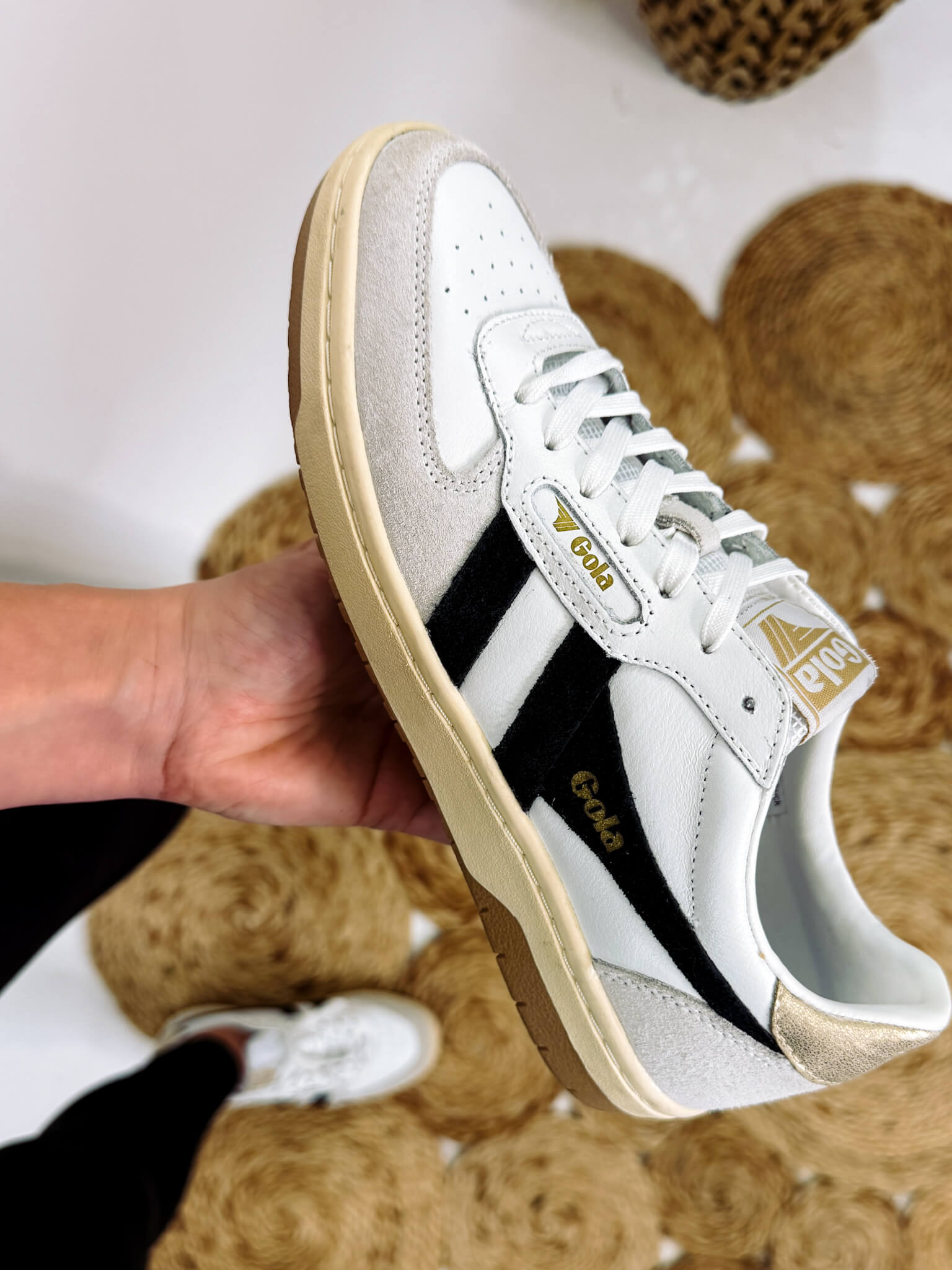 black white and gold sneakers