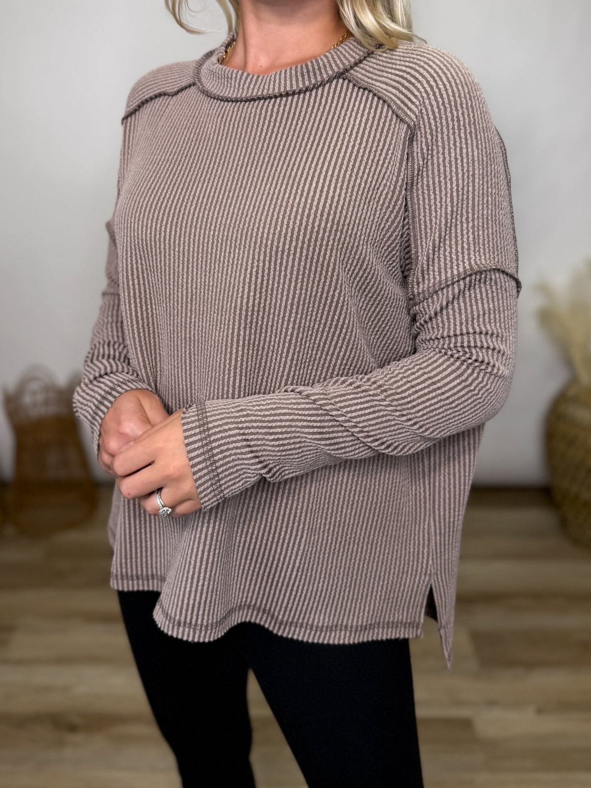 Neutral and versatile, this mocha ribbed long sleeve top is perfect for fall layering. Relaxed fit, exposed seams, and cozy stretch make it a wardrobe staple.
