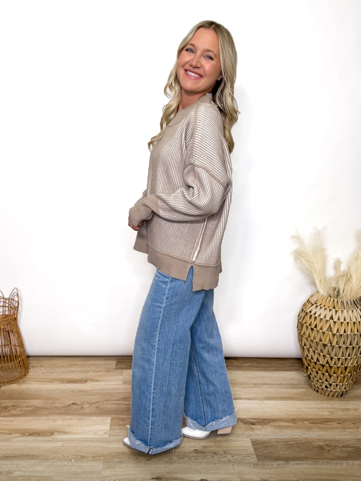 Cozy meets trendy in this neutral two tone ribbed sweater. Featuring exposed seams, side slits, and a relaxed fit. Perfect oversized fall to winter sweater.