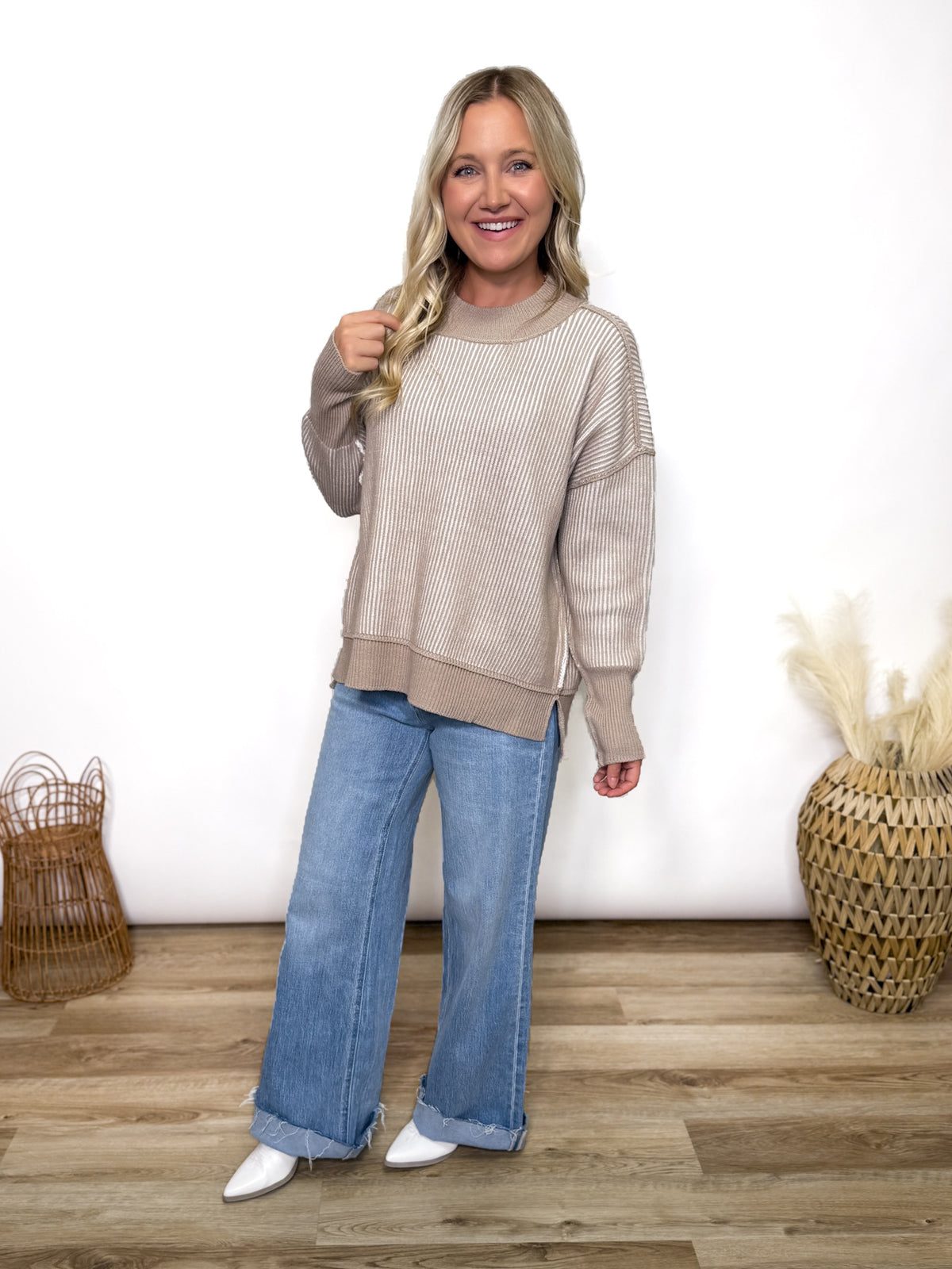 Cozy meets trendy in this neutral two tone ribbed sweater. Featuring exposed seams, side slits, and a relaxed fit. Perfect oversized fall to winter sweater.