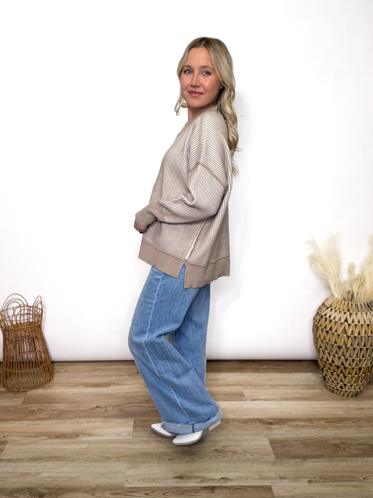 Cozy meets trendy in this neutral two tone ribbed sweater. Featuring exposed seams, side slits, and a relaxed fit. Perfect oversized fall to winter sweater.