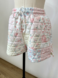 Quilted shorts with floral pattern with side slits, side pockets. Stretchy elastic drawstring waist. Matching lounge set.