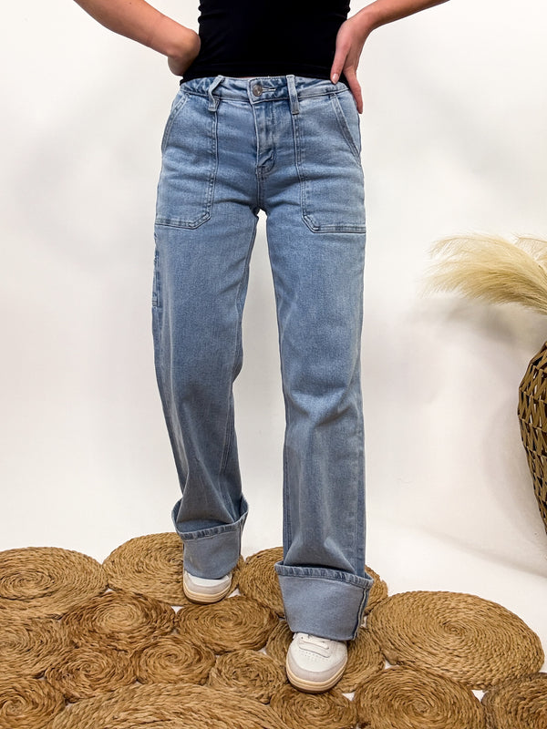 Carpenter Cuffed Wide Leg Comfort Stretch Jeans by Vervet Flying Monkey in a light wash. Features a high-rise waist, 32” inseam, and a stylish 4” cuff for a flattering wide-leg fit.