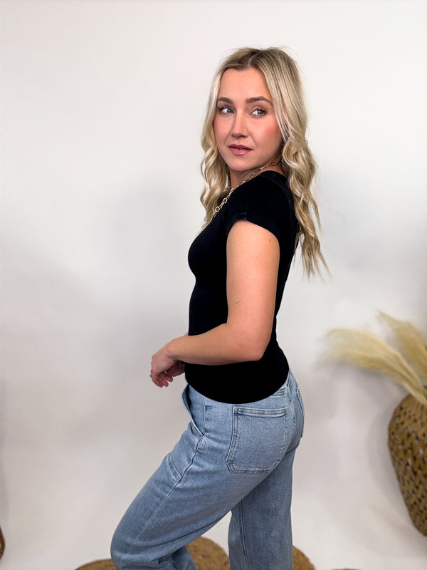 Black Short Sleeve Smoothing Seamless Top with a tailored fit, crew neckline, and ultra-smooth, stretchy fabric. Perfect for layering or wearing solo for a sleek and comfortable look.