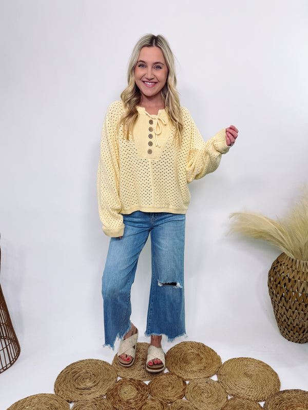 Yellow Henley button-up open knit sweater with an oversized fit, lightweight breathable cotton fabric, and a soft texture—perfect for spring and summer layering.