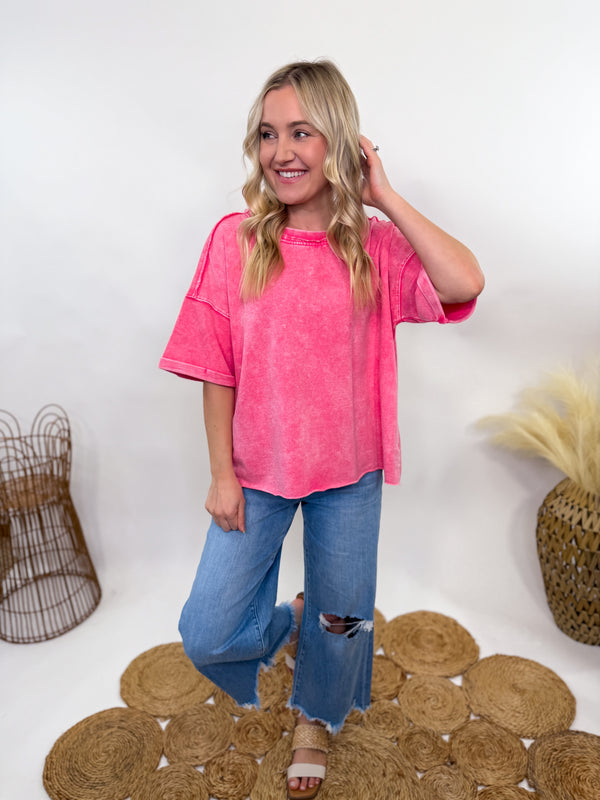 Fuchsia pink acid-washed oversized French terry tee with a raw hem and vintage-inspired fade. Soft 100% cotton fabric, relaxed fit, and breathable feel. Perfect for casual, sporty, or everyday styling.