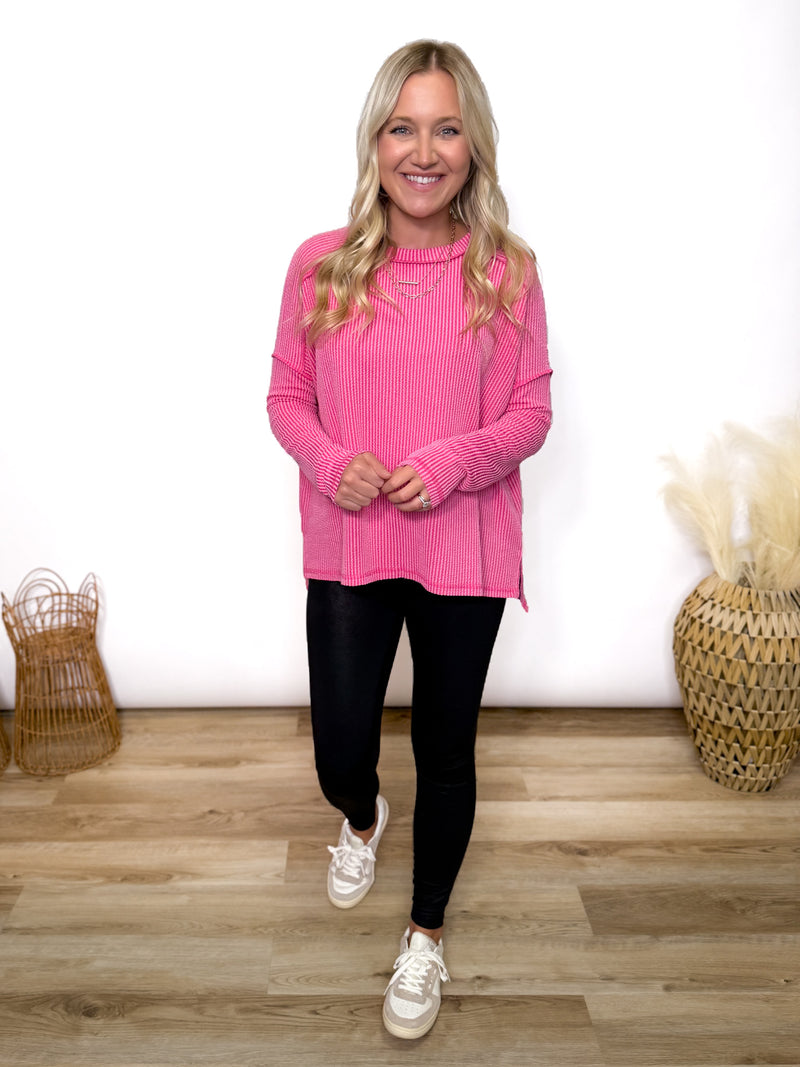 fuchsia ribbed long sleeve top with exposed seams and relaxed fit