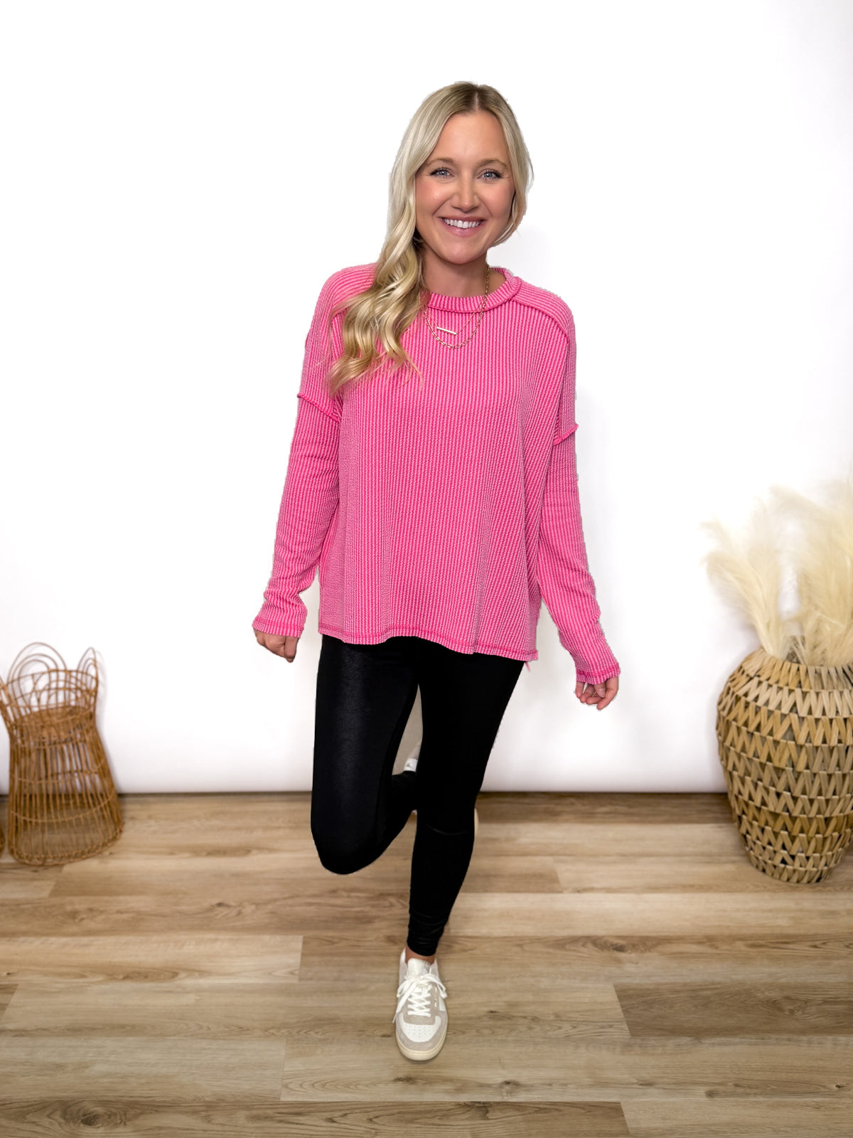 fuchsia ribbed long sleeve top with exposed seams and relaxed fit