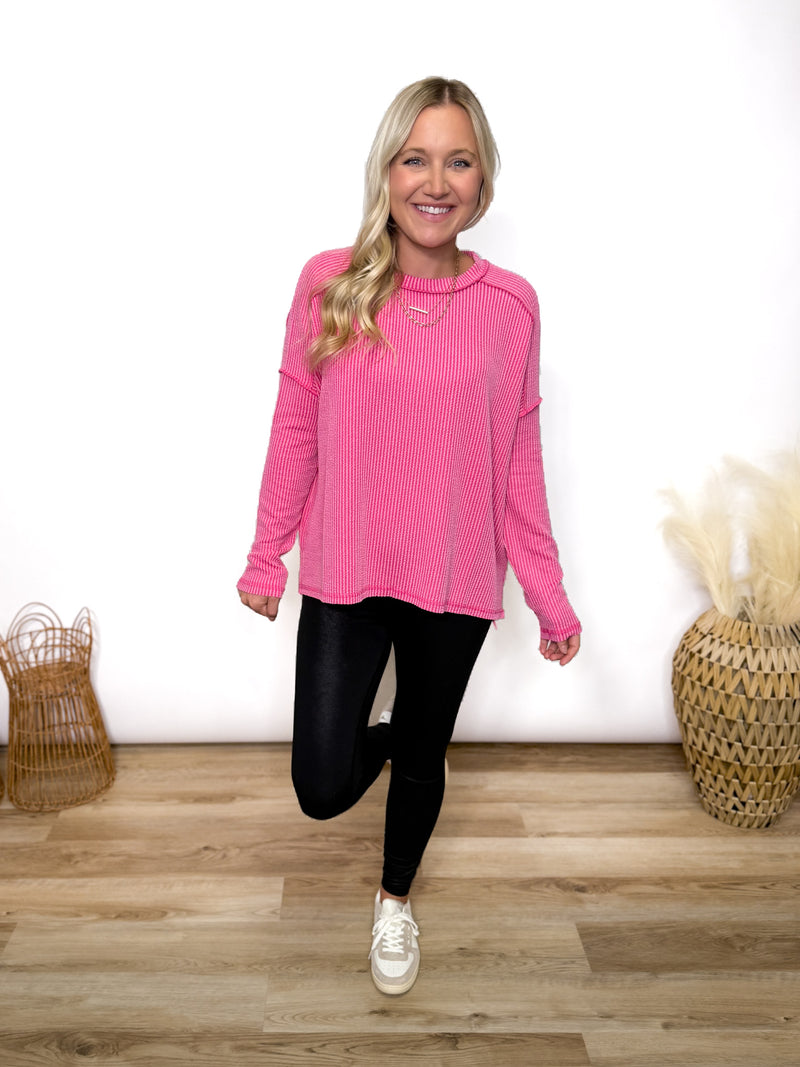 fuchsia ribbed long sleeve top with exposed seams and relaxed fit