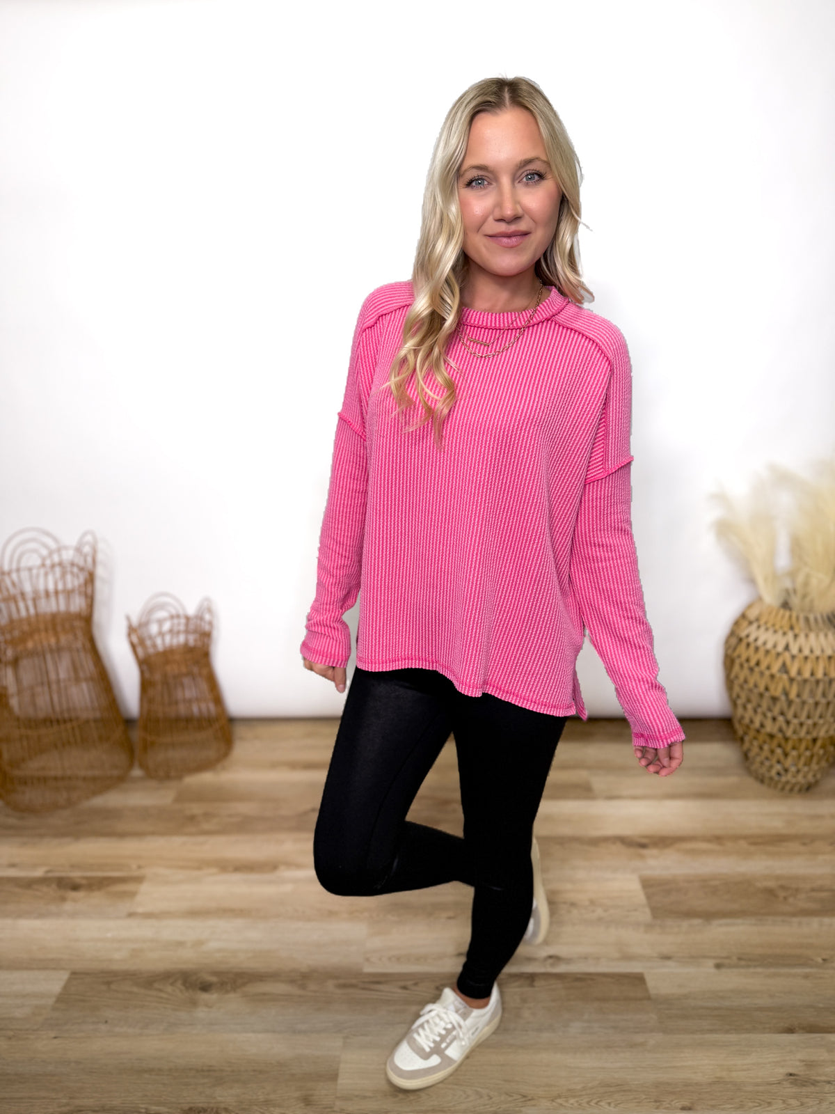 fuchsia ribbed long sleeve top with exposed seams and relaxed fit